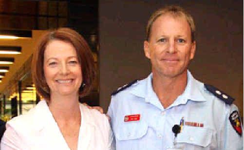 Prime Minister Julia Gillard with Gympie firefighter Rob Frey Prime Minister Julia Gillard with Gympie firefighter Rob Frey